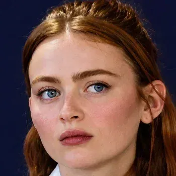Sadie Sink — Bright Spring celebrity example, warm auburn hair and clear blue eyes with freckled fair skin