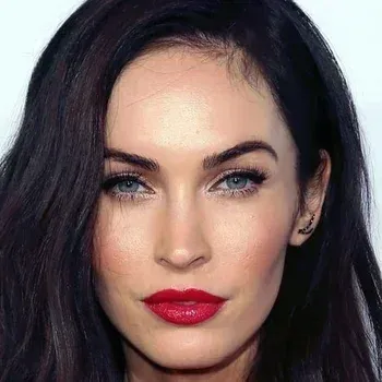Megan Fox — Bright Winter celebrity example, near-black hair, fair cool-neutral skin and vivid blue-green eyes