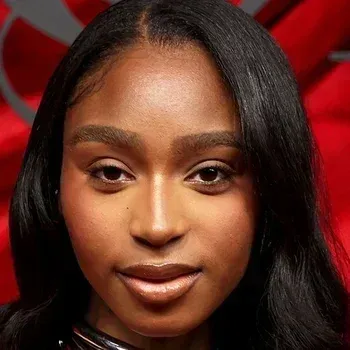 Normani — Deep Autumn celebrity example, deep warm golden-bronze skin, very dark hair and warm dark brown eyes
