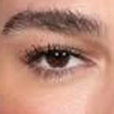 Dua Lipa's eyes — deep dark cool, Deep Winter quality
