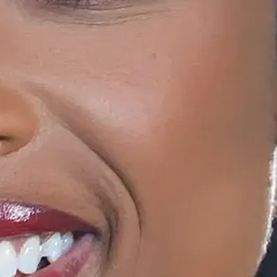 Jennifer Hudson's skin tone — deep warm golden-brown, Deep Autumn quality