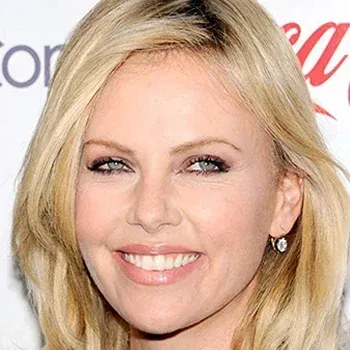 Charlize Theron — Light Summer celebrity example, ash blonde hair and pale grey-green eyes with very fair cool skin