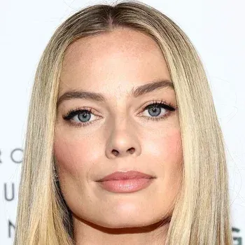 Margot Robbie — Light Summer celebrity example, cool blue eyes and fair cool skin with ash-toned blonde hair