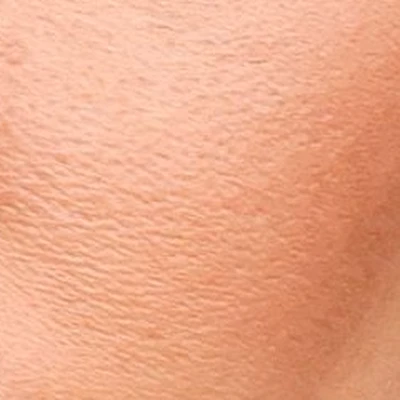 Miley Cyrus's skin tone — warm golden-olive, medium depth