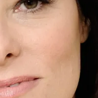 Parker Posey's skin tone — cool porcelain-ivory with pink undertones