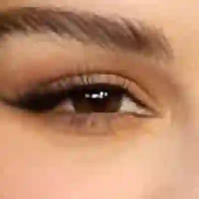 Selena Gomez's eyes — warm brown with golden undertone