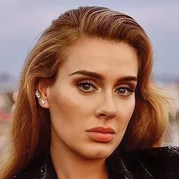 Adele — Soft Autumn celebrity example, warm golden-brown hair, fair peachy skin and soft hazel eyes