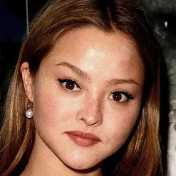 Devon Aoki — Soft Autumn celebrity example, warm golden-brown hair, fair warm skin with freckles and warm brown eyes