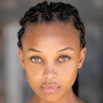 Kirby Griffin — Soft Autumn celebrity example, warm medium skin and amber-hazel eyes