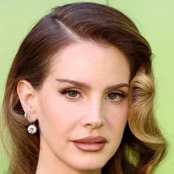 Lana Del Rey — Soft Autumn celebrity example, warm medium-brown hair, fair peachy skin and soft grey-green eyes