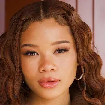 Storm Reid — Soft Autumn celebrity example, warm golden-brown hair, warm medium skin and warm brown eyes