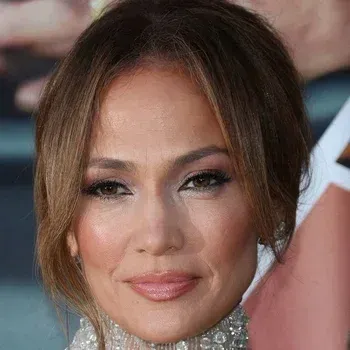 Jennifer Lopez — True Autumn celebrity example, warm golden-olive skin and warm brown eyes with warm brown hair