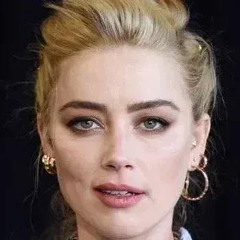 Amber Heard portrait — warm reddish-blonde hair, peachy skin, clear green eyes, True Spring celebrity colour analysis example